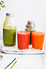 Green, orange red frutis veggies juice smoothie healthy detox food concept