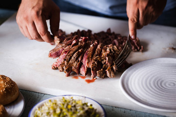 Chef chopping hot beefsteak steak skirts beef point steak cut person grill food