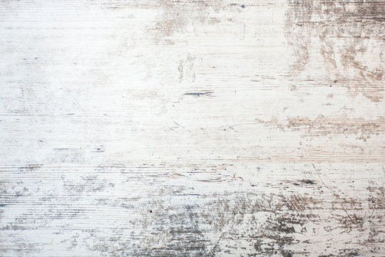 Light grey soft wood surface as background. Wooden textured surface