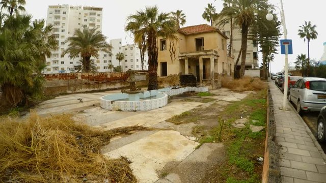 abandoned two-story building on border with closed ghost town Varosha in North Cyprus