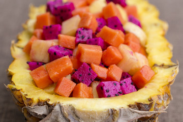 Fresh tropical fruit salad stuffed in pineapple. Thailand, close up