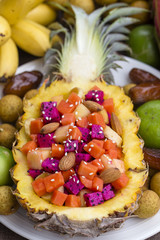 Fresh tropical fruit salad stuffed in pineapple. Thailand, close up