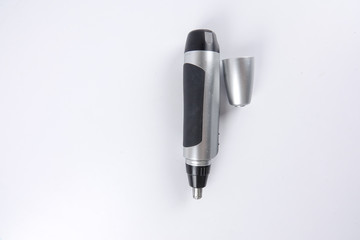 Fototapeta premium Battery powered nose hair trimmer isolated on white.