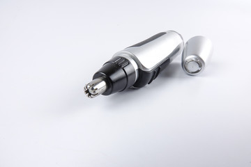 Battery powered nose hair trimmer isolated on white.