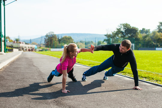 Man and woman doing push-up