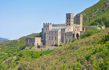 Medieval monastery Sant Pere de Rodes and landscapes of Spain - mountains and roads