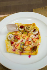 children prepare fruit pizza