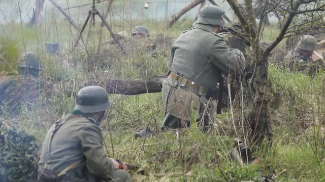 Historical reconstruction of Second World War. Soldiers on battle field during assault on Fort 5 in Koenigsberg. hostilities of Second World war. Slow Motion.
