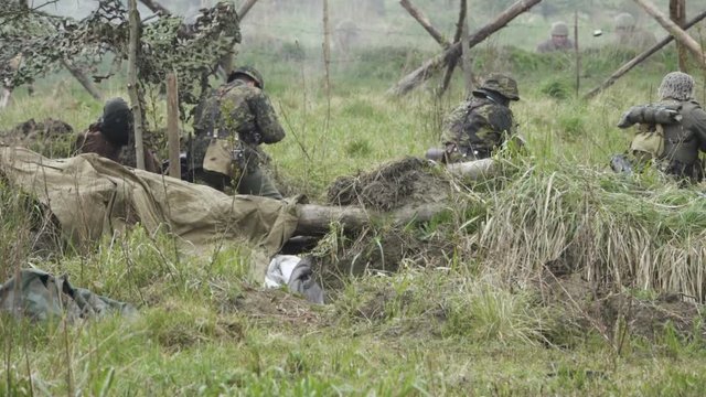 Historical reconstruction of Second World War. Soldiers on battle field during assault on Fort 5 in Koenigsberg. hostilities of Second World war. Slow Motion.