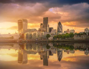 Gartenposter Skyscrapers of the City of London over the Thames river at sunset in England. © nuttawutnuy