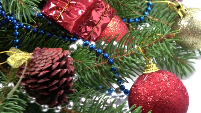 Close up of christmas balls on a fir tree branch