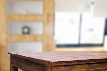 Empty of wood table top on blur of window glass in the morning background. for your photomontage or product display.