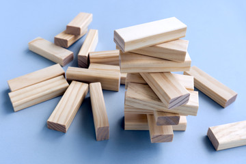 Business concept, building a business. Stacked and Collapsed on Wood Blocks.