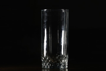 clear crystal empty glass on a black background.