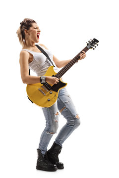 Punk girl singing and playing an electric guitar