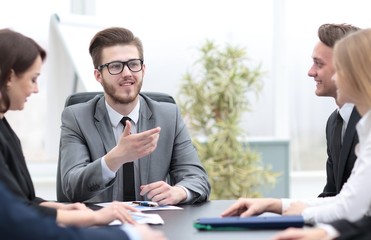 businessman at a meeting with employees