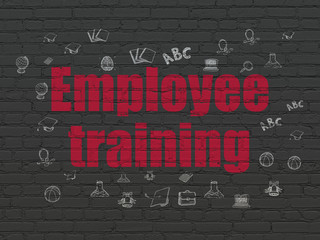 Studying concept: Painted red text Employee Training on Black Brick wall background with  Hand Drawn Education Icons