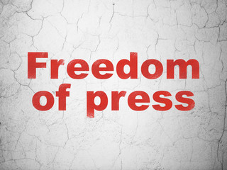 Political concept: Red Freedom Of Press on textured concrete wall background