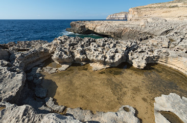 Karst rockpool on the northwest coast of the island of Gozo (Malta)