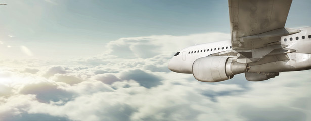Commercial flight flying over cloud sea