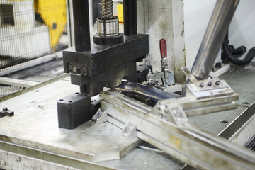 Fototapeta na wymiar Robot bending pipe in modern factory