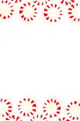  Christmas peppermint candy on a white background. Top view with copy space