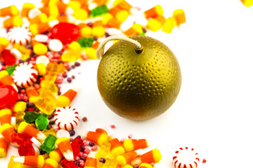 Colorful candy and toy bomb on a white background. The concept of sweetness is bad for your health