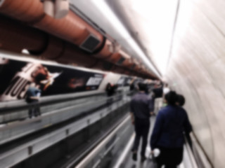 People walking in subway station.