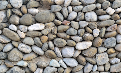 Naklejka premium wall lined with cobblestone background