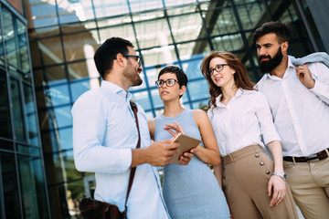 Fototapeta premium Businesspeople having discussion in front of company