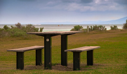 relax on the bench seat and take in the view of the beach