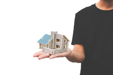 Man hand holding a  home model on isolate white background , Real estate concept