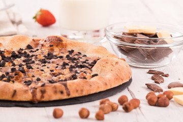 Sweet chocolate pizza with cookies.