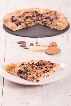 Sweet chocolate pizza with cookies.