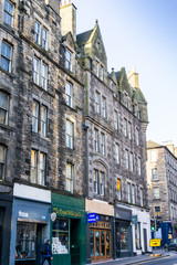 Naklejka na ściany i meble EDINBURGH, SCOTLAND - March 27, 2017: Street view of Historic Old Town Houses in Edinburgh, Scotland