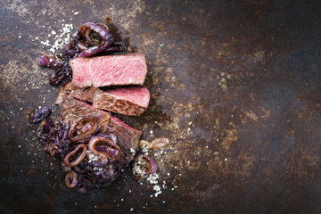 Barbecue dry aged Kobe rib eye steak as close-up on a board