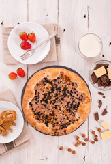 Sweet chocolate pizza with cookies.