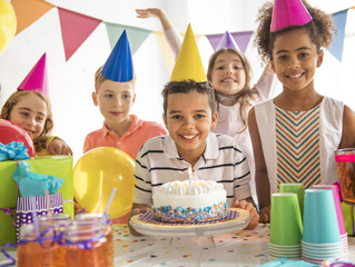 Group of adorable kids having fun at birthday party