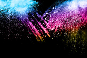 Multicolored powder splash on black background.