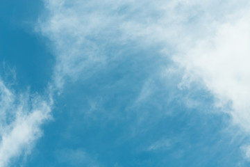 The blue backdrop has some clouds.