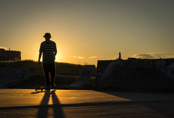 Late day skateboarding at the skate park