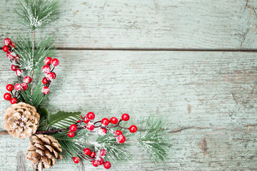 Christmas decoration of mistletoe, holly with berries,ivy and pine cones