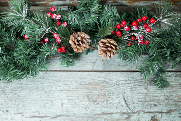 Christmas decoration of mistletoe, holly with berries,ivy and pine cones