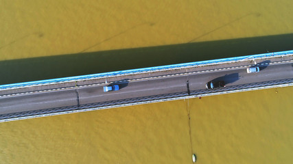 Aerial view. Cars using bridge which connected between islands. 