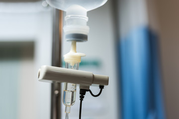 Close up saline solution drip for patient and infusion pump in hospital, Treatment of the disease of the doctor concept.