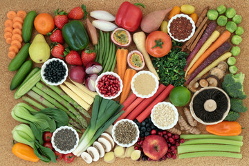 Super food for healthy diet concept with fresh vegetables, fruit, legumes, seeds, grains and cereals high in omega 3, anthocyanins, antioxidants, dietary fibre, vitamins and minerals. Top view.
