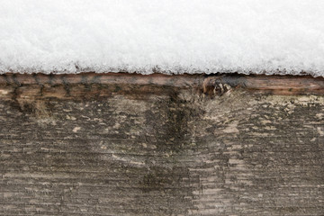 Snow and wooden  background