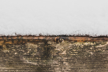 Snow and wooden winter background