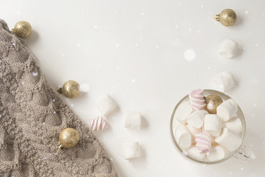 Warm Sweater Gold Christmas Decorations And Marshmallow.Winter Concept. Flat Lay. Top View. Christmas Composition.