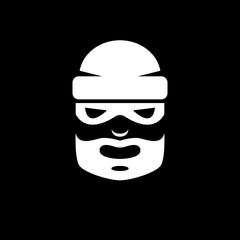 Black and white picture of a bearded thief in a mask